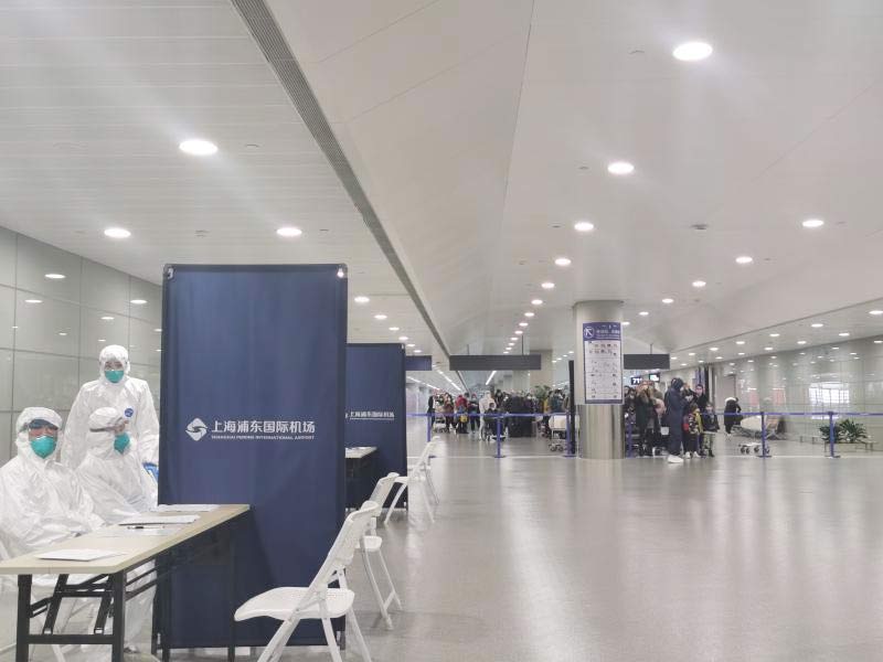 身穿誠格防護服的“守滬者” 24小時奮戰在浦東國際機場口岸防疫一線